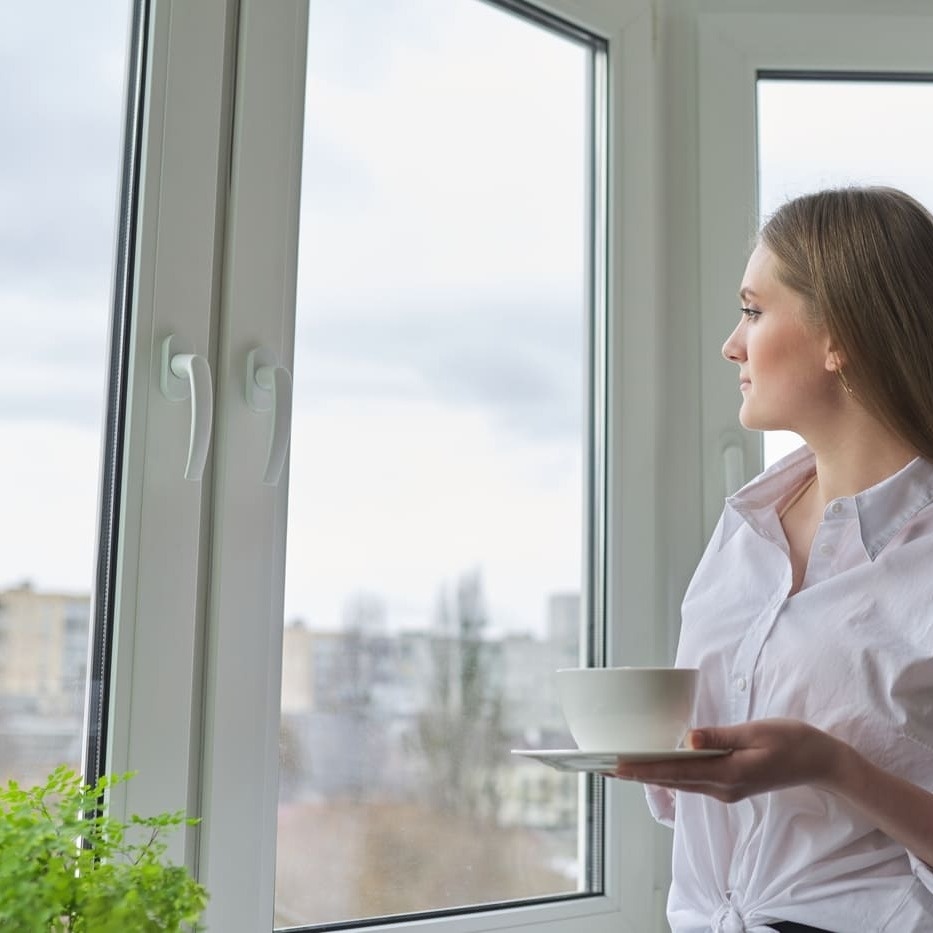 young-beautiful-woman-with-cup-of-tea-at-home-near-2024-12-08-01-30-53-utc-3 Cropped